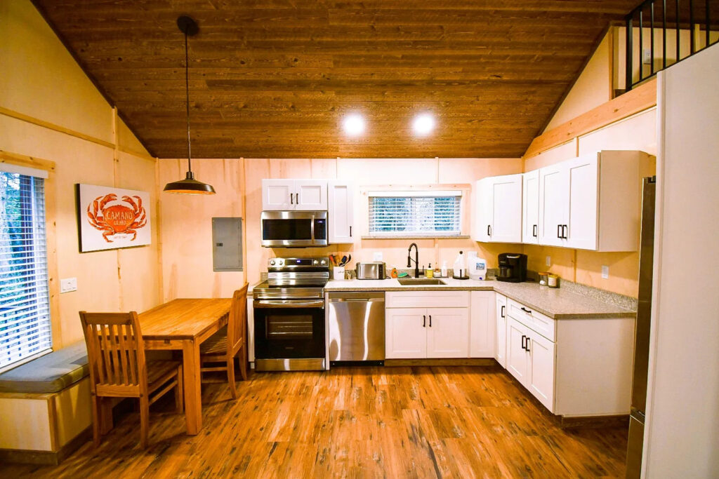image of cabin kitchen with wood flooring and ceilings