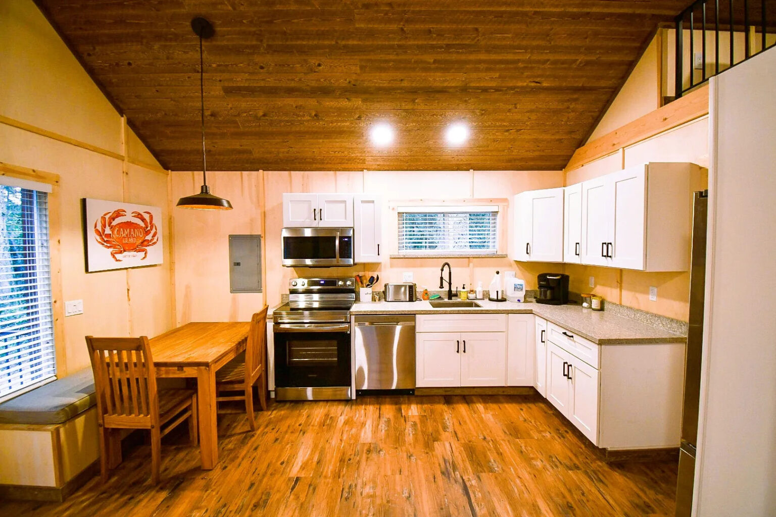 image of cabin kitchen with wood flooring and ceilings