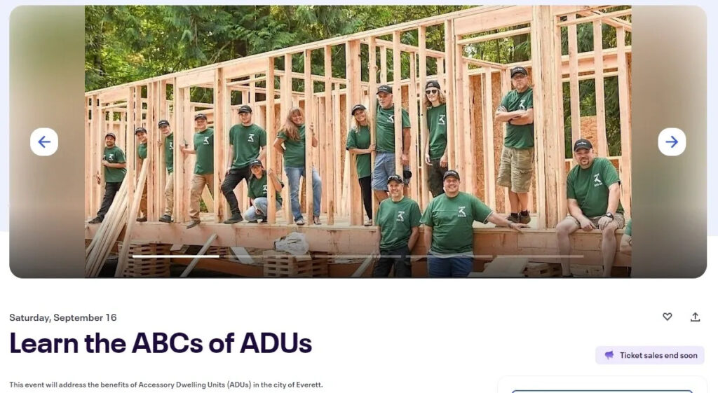 image of CHNW team standing inside of a framed modular community building.