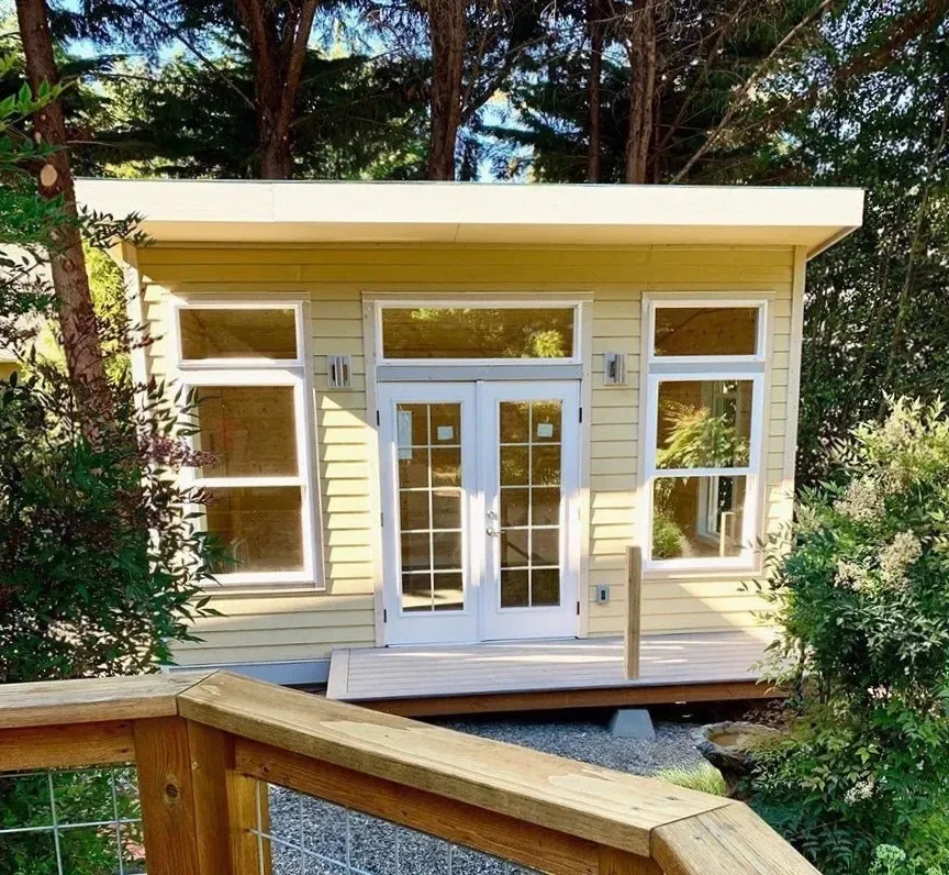 image of art studio/backyard cottage with french doors and 7+ windows.